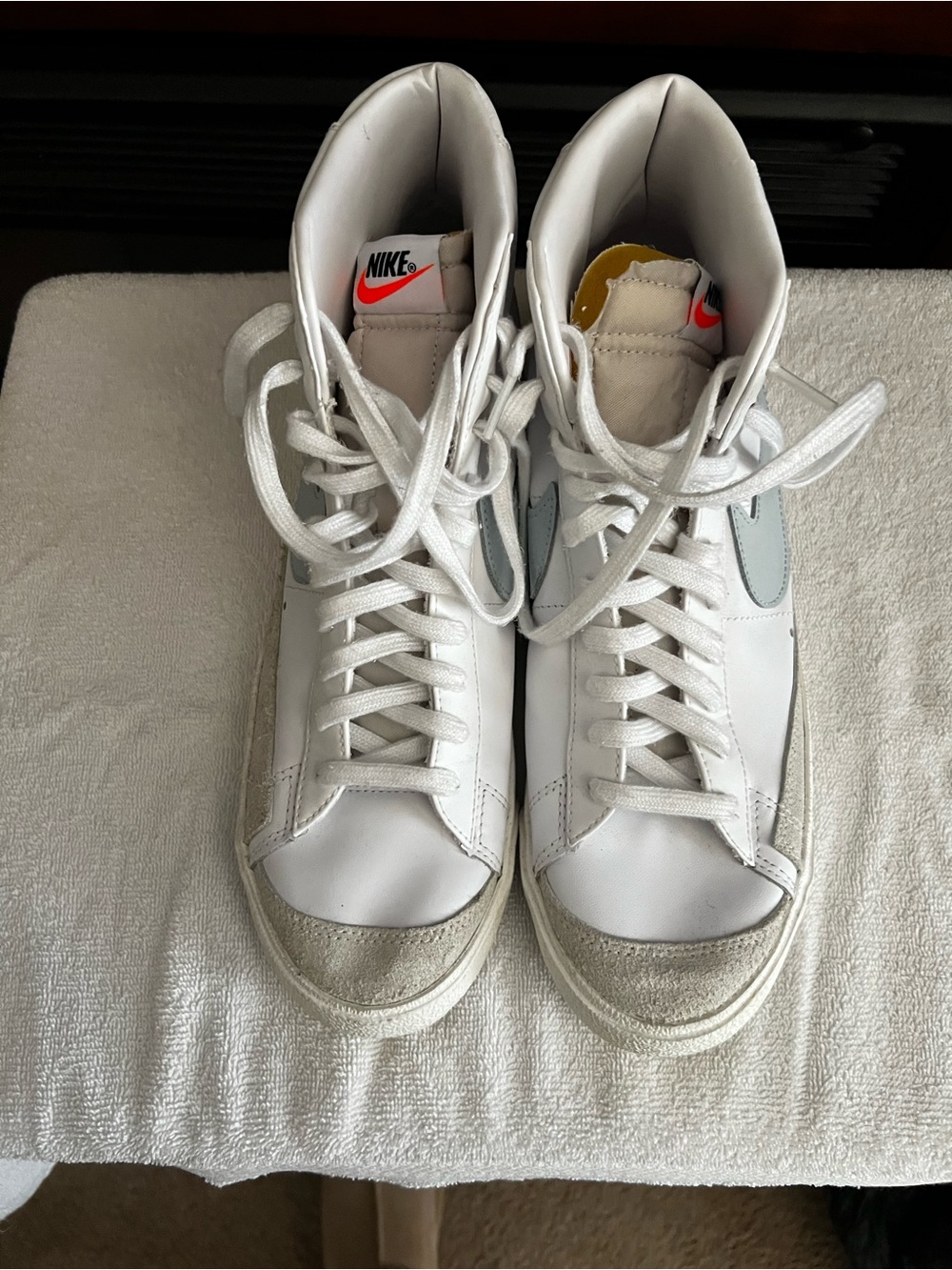 Nike White High-Top Sneakers with Grey Accents and Orange Tongue Logo